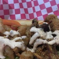 Poboy901 Oyster · A generous amount of fresh gulf oyster piled on a seven-inch bun dressed with lettuce, pickl...