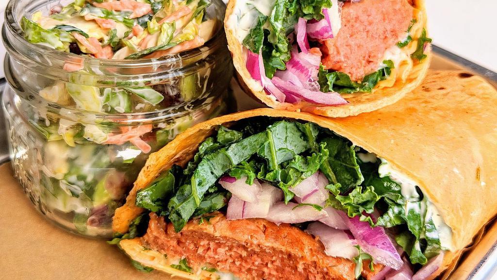 Meatless Burger Wrap  · Vegan. Beyond Meat Vegan Burger Patty topped with melted Vegan Cheese in a Tortilla Wrap filled with Seasonal Greens, Tomato, Red Onion, Avocado and Vegan Ranch.