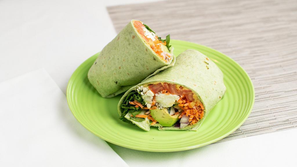 Vegetarian Wrap · Vegan Upon Request. House Hummus, Tomato, Spinach, shredded Carrot, Cucumber, Avocado, Red Onion, roasted red Peppers and Feta in a warm tortilla wrap.