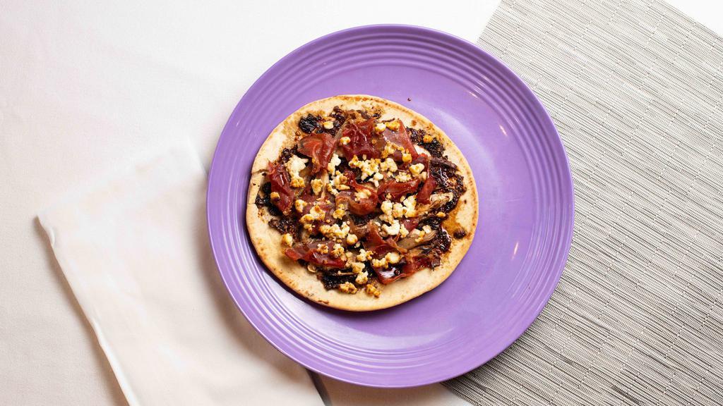 It'S Our Mission · Mission Fig Jam, Caramelized Balsamic Onions, Goat Cheese, Shiitake Mushrooms, and Prosciutto.
