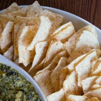 Spinach Dip · Creamy spinach served with chips.