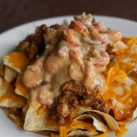 Gator Nachos · A Mambo’s original dish. Homemade tortilla chips topped off with melted cheddar cheese,
smot...