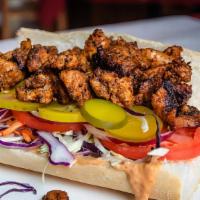 Blackened Alligator Po-Boy · Dressed with tomatoes, pickles, onions. Remoulade and coleslaw.