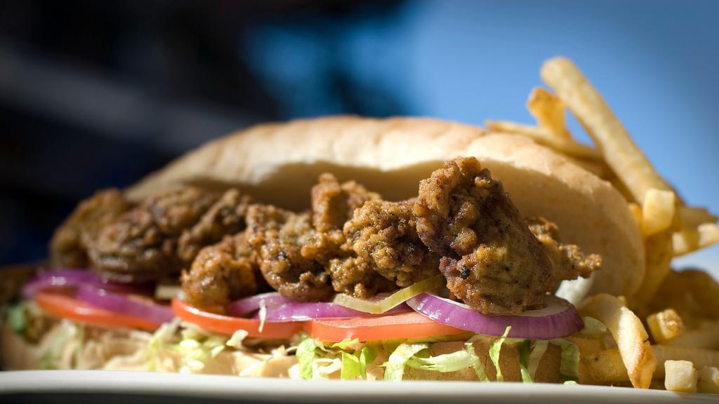 Oyster Po-Boy · Make it buffalo for additional charge dressed with tomatoes, pickles, onions. Remoulade and coleslaw.