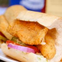 Fried Fish Po-Boy · Dressed with tomatoes, pickles, onions, remoulade and coleslaw.