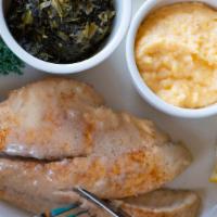 Grilled Red Fish Beurre Blanc · Topped with lemon beurre Blanc sauce. Served with grits and mustard greens.