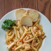 Carnival Pasta · Louisiana Crawfish tails and Gulf shrimp tossed in our homemade Alfredo sauce with freshly d...