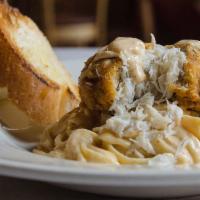 Crab Cake Pasta · Our famous crabmeat cake over a bed of penne noodles tossed with alfredo sauce.