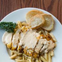 Chicken Alfredo Pasta · Lightly breaded, sauteed chicken breast strips simmered in alfredo sauce with penne noodles.