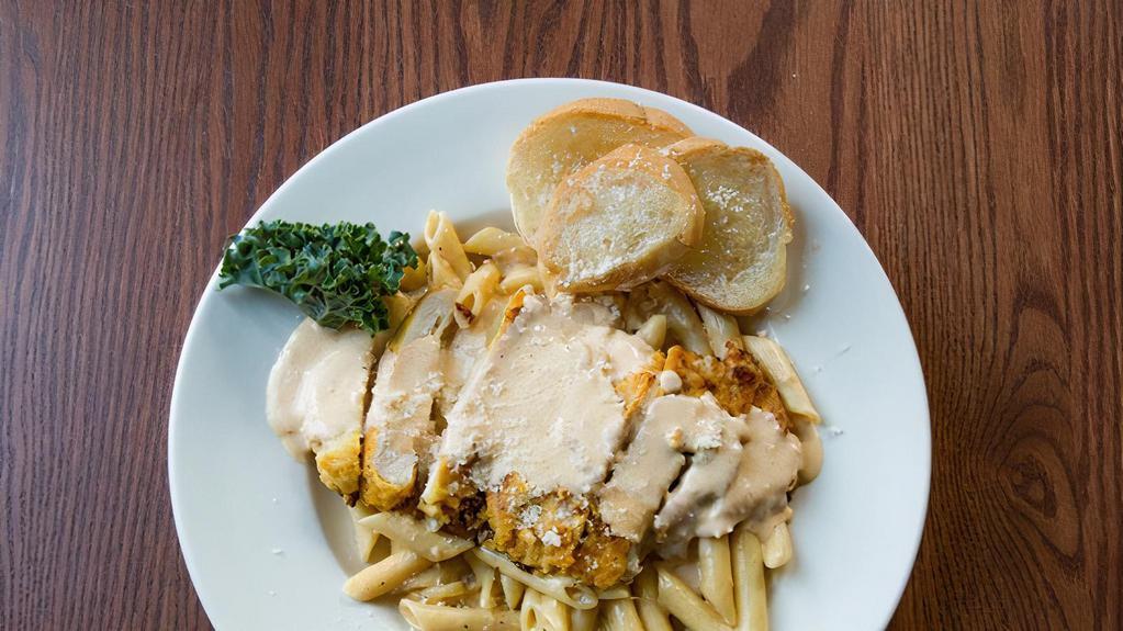 Chicken Alfredo Pasta · Lightly breaded, sauteed chicken breast strips simmered in alfredo sauce with penne noodles.