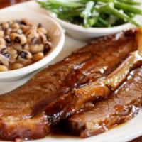 Beef Brisket · Gluten-free. Smoked slow and low until fork-tender, served with Western BBQ sauce. Served wi...