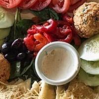 Greek Dip Plate. · Tzatziki, spicy feta dip, and hummus, tomatoes, olives, sliced cucumbers, and grilled pita.