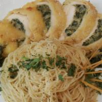 (L) Chicken Marino · Chicken breast stuffed with spinach and parmesan, panko breaded and baked, topped with a gre...
