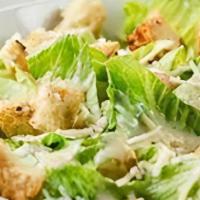 As Meal Small Caesar Salad. · Romaine lettuce tossed with homemade croutons, caesar dressing, and topped with parmesan che...