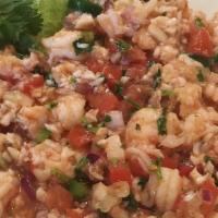 Ceviche Tropical · Shrimp or fish marinated in lime juice and mixed with tomatoes, onions and cilantro.