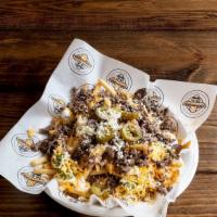 Bandido Super Fries · French fries topped with your choice of grilled steak or chicken, refried beans, sour cream,...
