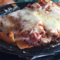 Lasagna · Thick layers of fresh pasta, meat sauce, ricotta, and Mozzarella.
