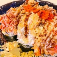 Volcano Roll · Seaweed wrapped: crab stick, cucumber, avocado at the bottom, snow crab, spicy tuna, dynamit...