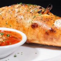 Stromboli · Meatball, sausage, pepperoni, onions and peppers, tossed in marinara sauce, covered with moz...