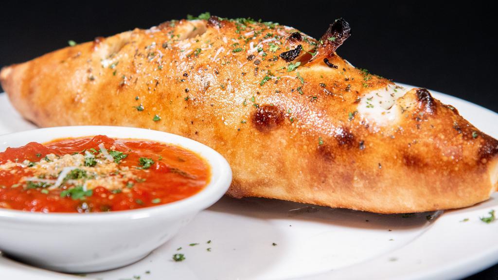 Stromboli · Meatball, sausage, pepperoni, onions and peppers, tossed in marinara sauce, covered with mozzarella and baked in a pizza pocket.
