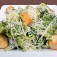Caesar Salad · The classic Caesar salad.   Romain lettuce, croutons and dressing