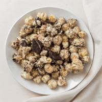 Cookies & Cream · French Vanilla popcorn rolled in White chocolate and crushed Oreo cookie pieces