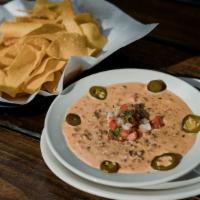 Loaded Queso · Beef, jalapenos and pico de gallo.