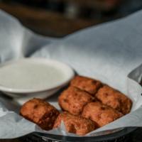 Tater Kegs · fried potatoes stuffed w/ cheddar cheese, bacon, sour cream, & a hint of chives, served w/ra...