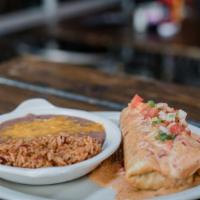 Philly Changa · JJ’s famous philly steak wrapped in a flour tortilla, deep fried, & topped w/ queso & pico d...