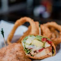 Pineapple Chicken Wrap · grilled asian chicken, juicy grilled pineapple, lettuce, red onion, roasted red peppers, avo...