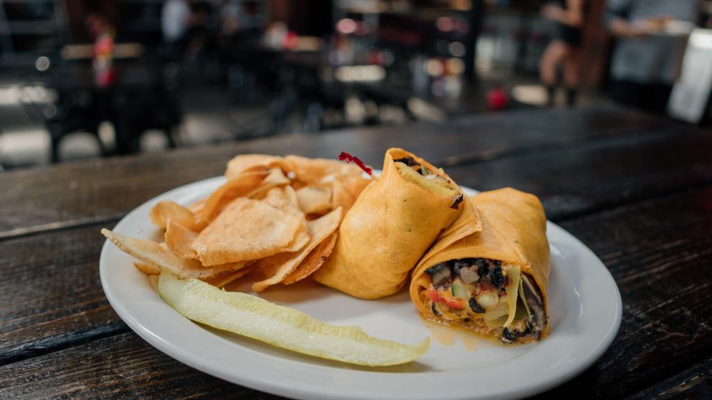 Hot Veggie Wrap · spinach, zucchini, yellow squash, roasted red bell peppers, shredded cheddar cheese, black beans, portabella mushrooms, & chipotle mayo