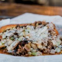 Philly Cheese Steak Sandwich · Thinly sliced rib eye steak with mushrooms, green bell peppers, grilled onions and JJ's chee...