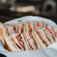 Club Sandwich · Fresh oven-roasted turkey and crispy bacon served triple-decker on toasted bread with lettuc...
