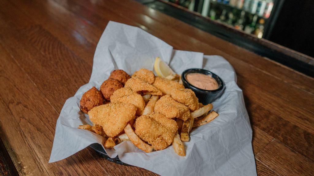 Catfish Nuggets · imported catfish w/ chipotle tartar sauce, served w/ 
hand-cut fries & hush puppies