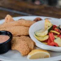 Fried Catfish · Two deep-fried catfish fillets, served with hush puppies and chipotle tartar sauce.
