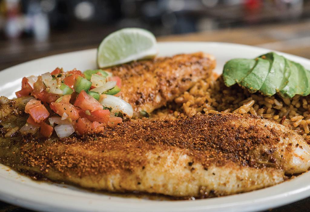Southwest Grilled Catfish · Two seasoned grilled catfish fillets served over Spanish rice with pico de gallo and avocado.