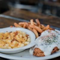 Chicken Fried Chicken · Chicken breast hand-breaded in a seasoned batter, deep fried to a golden brown and smothered...