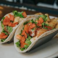 Ranch Chicken Tacos · flour tortillas filled w/ grilled chicken, greens, tomatoes, bacon, pepper jack cheese, & ra...