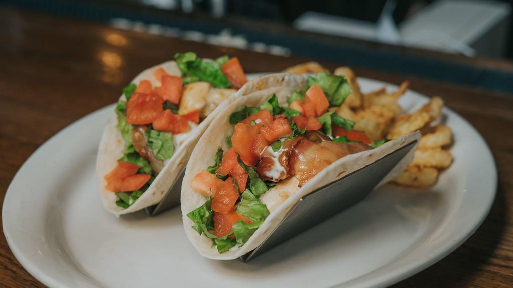 Ranch Chicken Tacos · flour tortillas filled w/ grilled chicken, greens, tomatoes, bacon, pepper jack cheese, & ranch