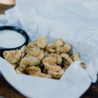 Fried Pickles · Hand battered pickles deep fried and served with ranch.