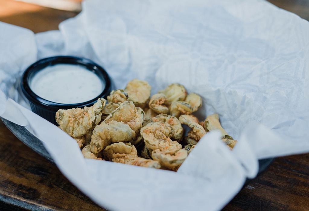 Fried Pickles · Hand battered pickles deep fried and served with ranch.