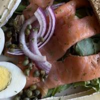 Smoked Salmon And Brie · Chilled smoked salmon plated with hard boiled egg, capers, brie cheese and red onion served ...