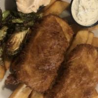 Fish And Chips · Deep fried fillets of cod, served on a bed of seasoned steak fries with a side of coleslaw a...