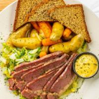 Corned Beef And Cabbage · Slow cooked brisket of beef, sliced and served with braised napa cabbage, fingerling potatoe...