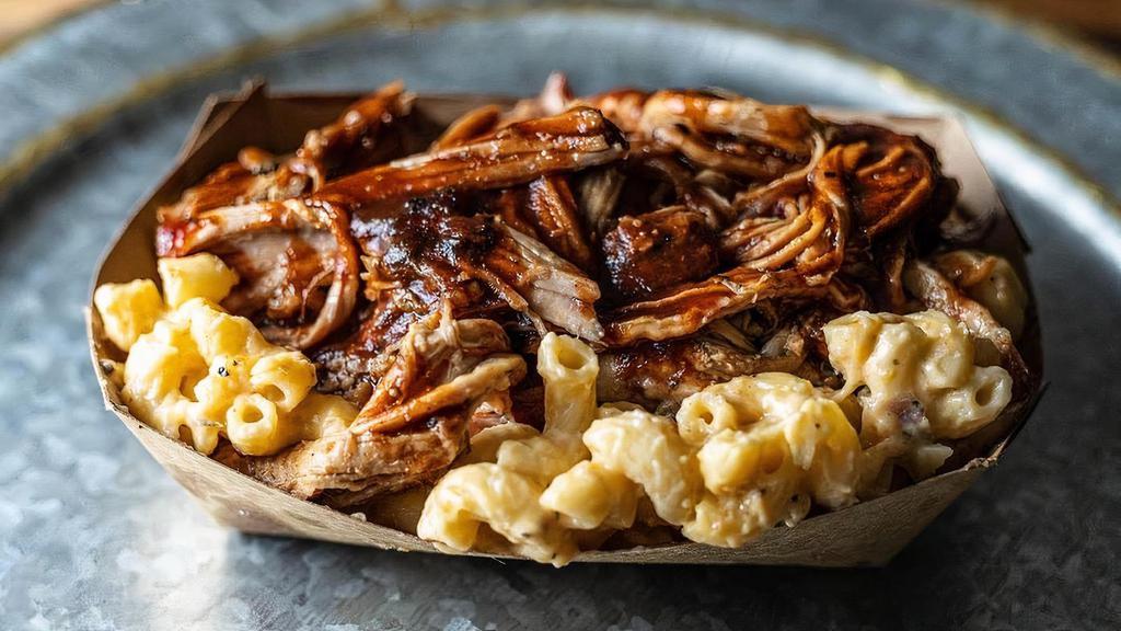 Loaded Mac & Cheese · White Cheddar Mac & Cheese topped with your choice of Pulled Pork, Housemade Sausage, Pulled Chicken or Brisket (+$)