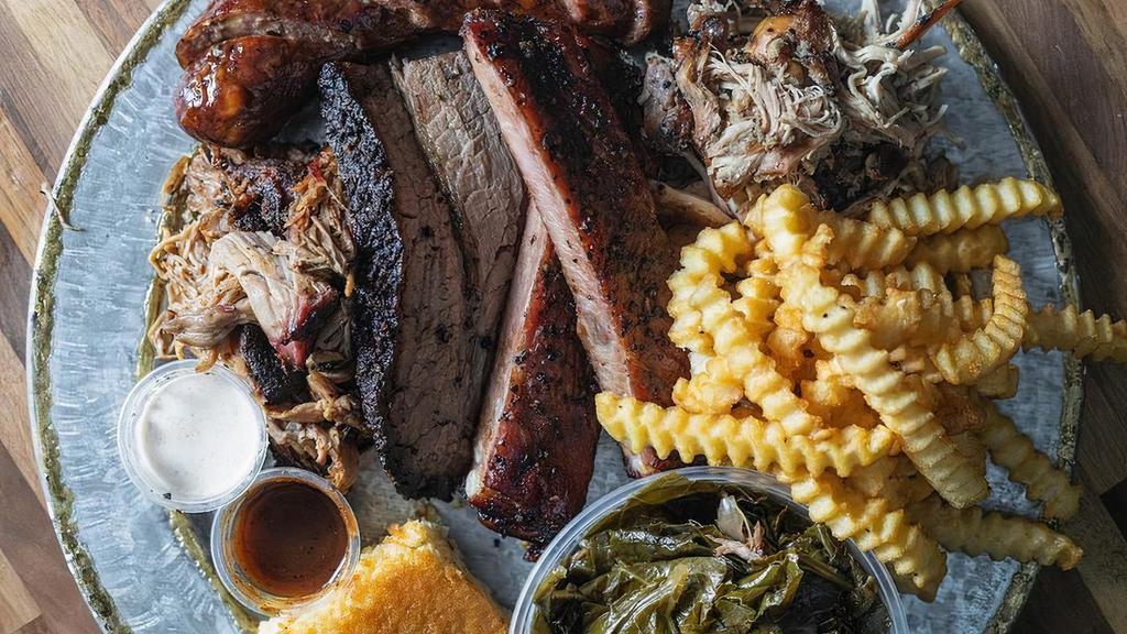 Meat Sweats Platter · Includes sliced brisket, ribs, pulled pork, pulled chicken & housemade sausage, choice of 2 sides and white bread. Feeds 1-2 adults (how hungry are you?!).