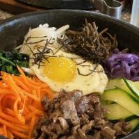 Dolsot Bibimbap · Rice topped with assortment of seasoned vegetables and fried egg, all cooked in a hot stone ...