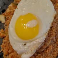 Kimchi Fried Rice · Wok-tossed with kimchi, carrots, onions and topped with fried egg.
