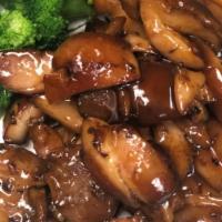 Bourbon Chicken · Marinated chicken cooked in house special sauce with few broccolis on the bottom.