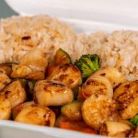 Hibachi Scallops & Shrimp · Serve with Broccoli, Carrot, Zucchini & Onion 
Fried Rice  And one White Sauce .